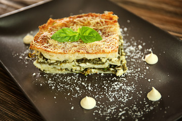 Lasagna with spinach on plate, close up