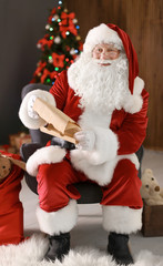 Authentic Santa Claus reading wish list indoors