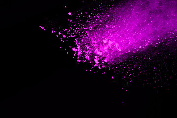 Abstract of purple powder splatted background,Freeze motion of color powder exploding.