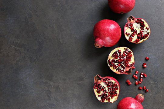 Pomegranate. Fresh Ripe Pomegranate Overhead Dark Concrete Background. Top View, Copy Space