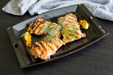 Grilled Chicken in Cast Iron Pan with Squash Blossoms