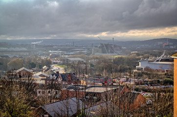View over the town of Rotherham, including Rotherham United's New York Stadium, very industrial and urban under stormy grey sky