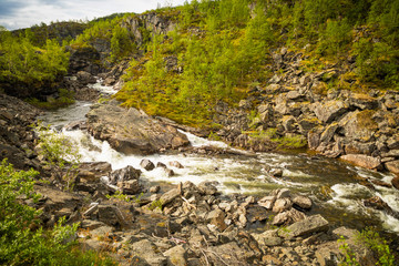 Small beautiful norwegian river in nord part of Norway