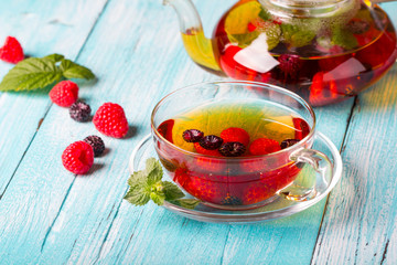 raspberry berry tea kettle cup fresh wooden
