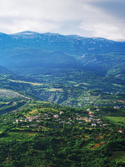 Obraz premium Mountains of the crimea and the green forest and village