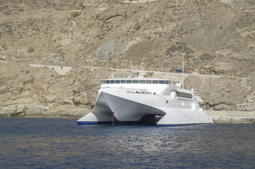 New white catamaran passenger ferry in port Santorini © isabela66