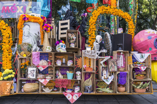 Day of the Dead offering Colorful flowers and objects honoring the departed souls 
