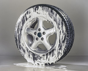 Generic Wheel with metal rim Great tire image used in all automobiles  Foamy tire being washed