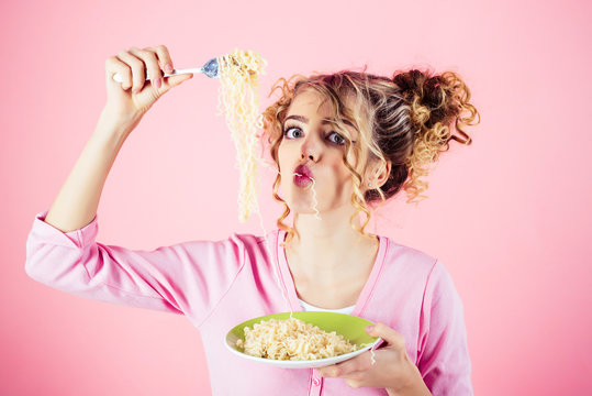 Funny Girl Eating Noodles. Morning Breakfast. Girl Hold Plate Of Spaghetti. Attractive Woman Eating Noodle. Adorable Woman With Curly Hair Eating Pasta. Fashion And Beauty. Diet, Food, Meal, Italy.