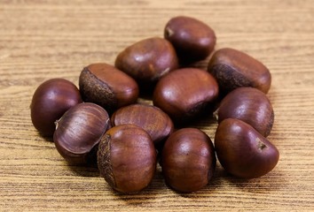 Delicious Roasted Chestnuts on Wooden Table
