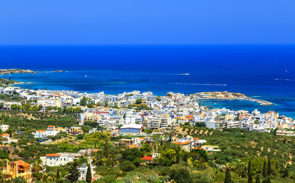 Greek holidays - beautifulcity of Hersonissos, view from the top of mountain with turquoise sea. Crete island
