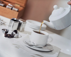 Obraz premium Elegant pouring teapot Intense herbal flavor infusion