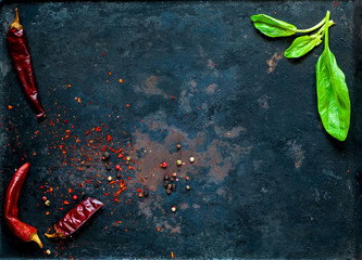 spinach and  spices, Various vegetarian ingredients on dark vintage background of old rusty metals, top view. Healthy food, vegan or diet nutrition concep copy space, closeup
