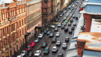 Car traffic in city St.Petersburg downtown, urban landscape with historical buildings and road, aerial view from rooftop