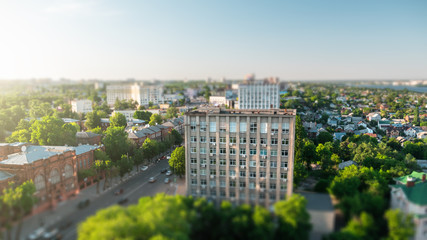 Tilt shift blurred city Voronezh, panoramic modern cityscape skyline in summer sunny day, aerial...