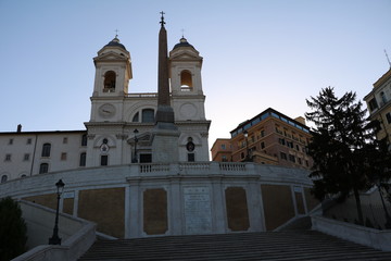 View to Church Santissima Trinità dei Monti at Spanish stairs at sunset in Rome, Italy 