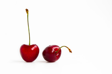 two ripe cherries fruit on a white background