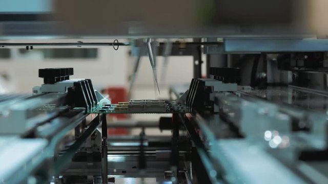 Robotic Machine Testing Circuit Boards for Serviceability
