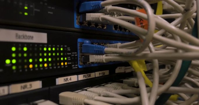 High Quality footage of a network cables in a network room. Filmed in 4K.