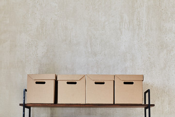 Shelf with boxes and books