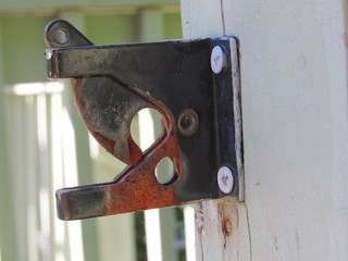 An old rusted gate latch