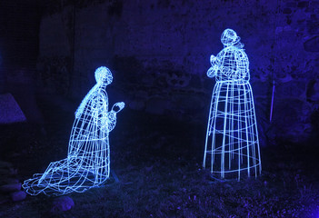 Festival of light. Historical figures at Torun castle. Poland © Andrey Shevchenko