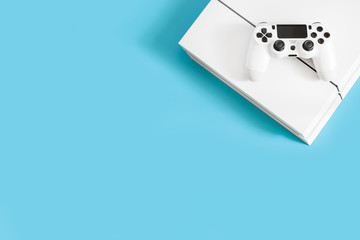 console games and remote control on blue background, play computer games, entertainment, virtual...