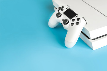 console games and remote control on blue background, play computer games, entertainment, virtual...