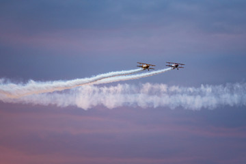 Fototapeta na wymiar Airplanes flying at sunset