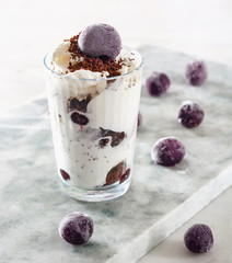 Ice cream with cherry berries marble countertop background