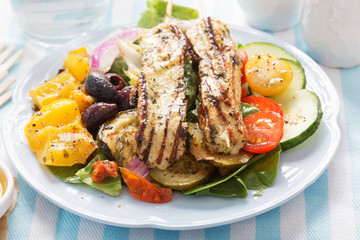 Mediterranean halloumi salad. Marinated chargrilled halloumi, cucumber, cherry tomatoes, roast peppers, olives with honey & mustard dressing