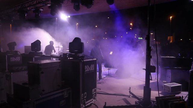 Crowd people, cheering fans at a life concert, slow motion, in live concert festival music movement