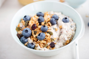 Oats with granola, dried cranberries, pumpkin seeds and blueberries 