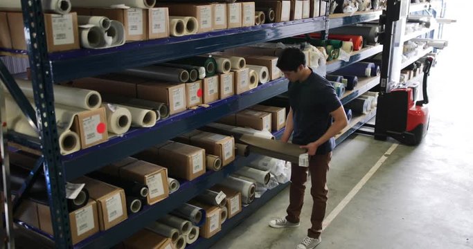 Male looking for item in distribution warehouse