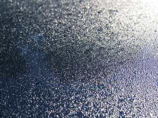 Water droplets on a black surface