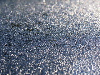 Water droplets on a black surface