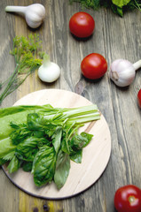 Basil and salad on a chopping Board