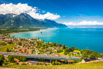 Naklejka premium Panorama view of Villeneuve city with Swiss Alps, lake Geneva and vineyard on Lavaux region, Canton Vaud, Switzerland, Europe
