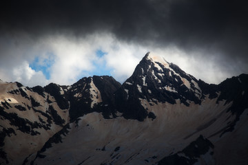 Fototapeta premium Beautiful nature landscape of snow mountains. Telephoto zoom lens shot