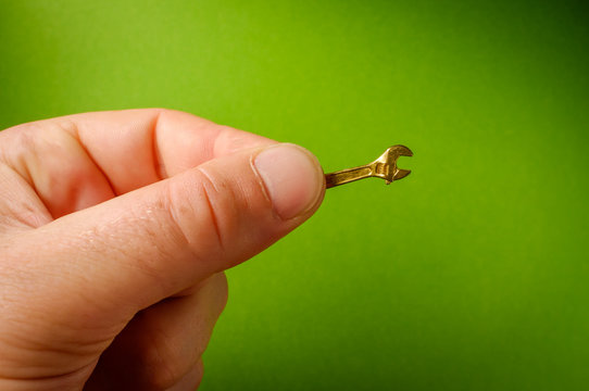 Holding Tiny Adjustable Wrench