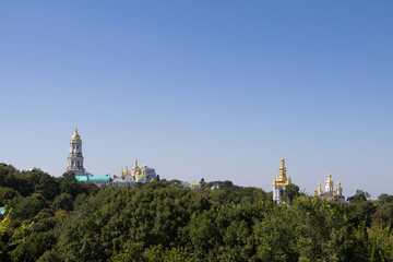 Panorama of Kiev Hills with a skyline made of the domes of Pechersk Lavra Monastery and churches, surrounded by a wood. it is one of the main landmarks of the city