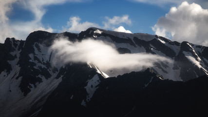 Beautiful nature landscape of snow mountains. Telephoto zoom lens shot