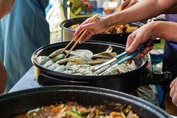 Preparation of food at the market stall