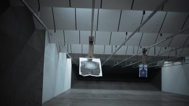 A Silhouette target at a gun range slides away from the camera - Dark cinematic version