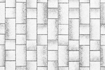 Modern white stone tile wall pattern and background