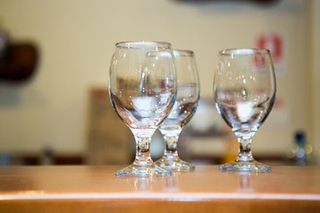 Empty glasses at the bar
