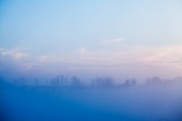 Countryside winter landscape at sunset
