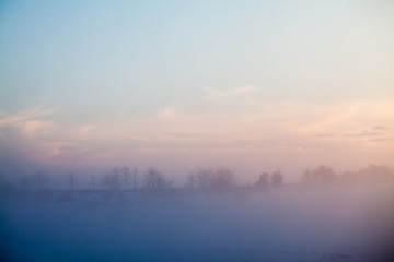 Countryside winter landscape at sunset
