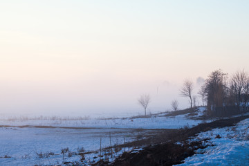 Countryside winter landscape at sunset
