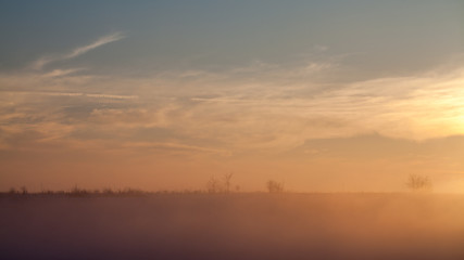 Countryside winter landscape at sunset
